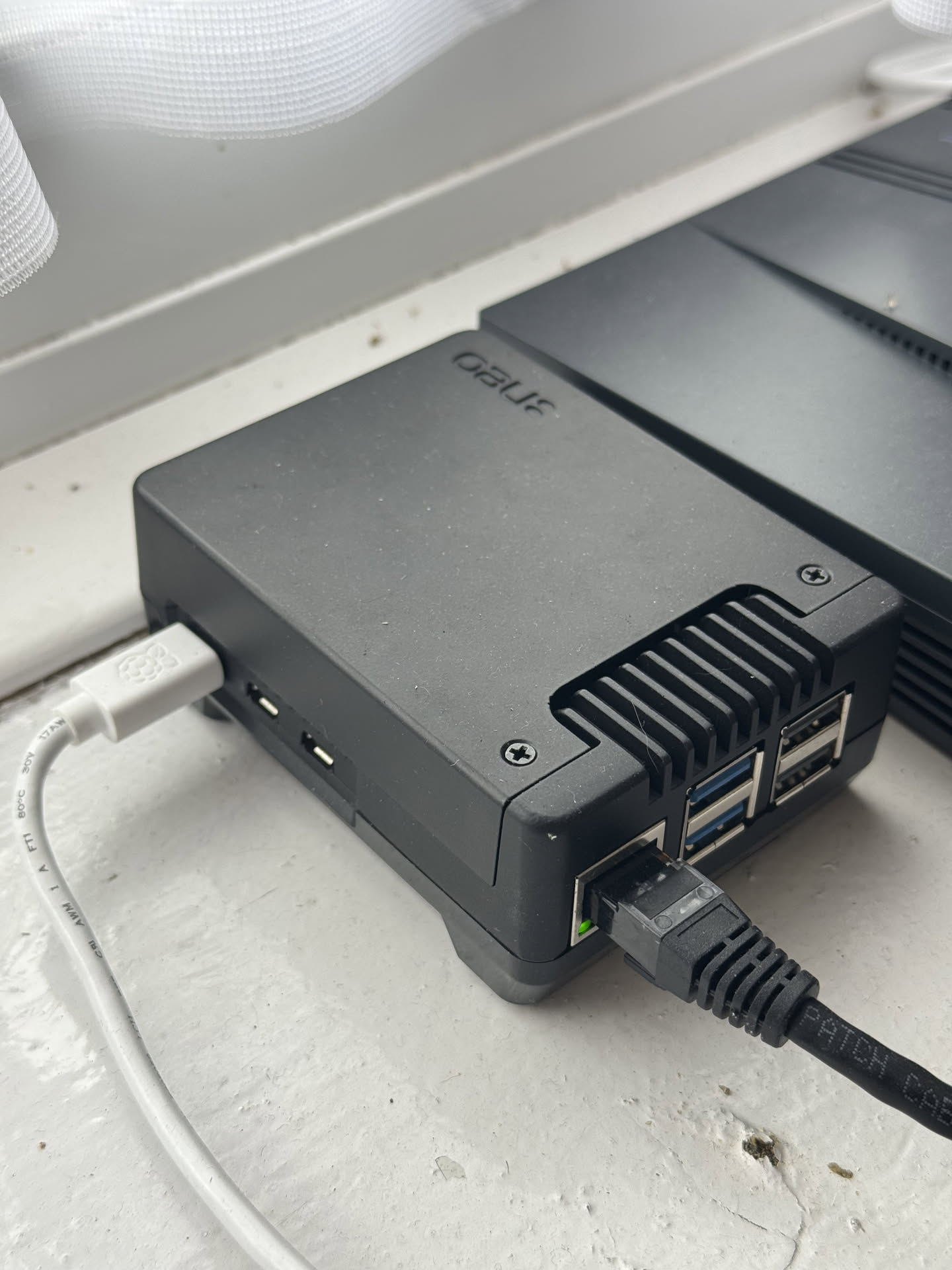 a photograph of a raspberry pi inside a black metal case